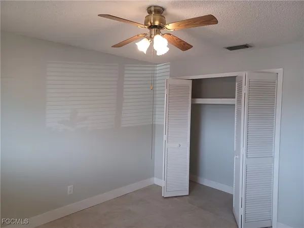 a view of a livingroom with a ceiling fan