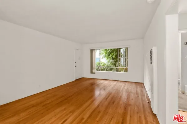 a view of an empty room and window