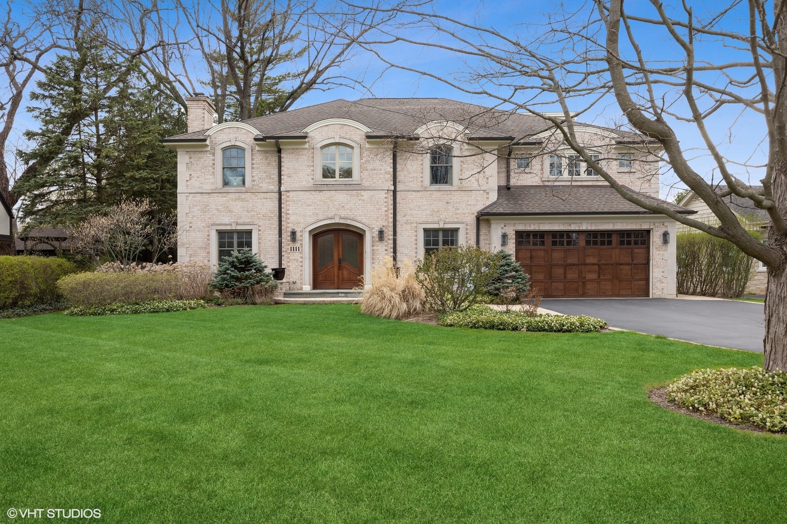 a front view of a house with a garden