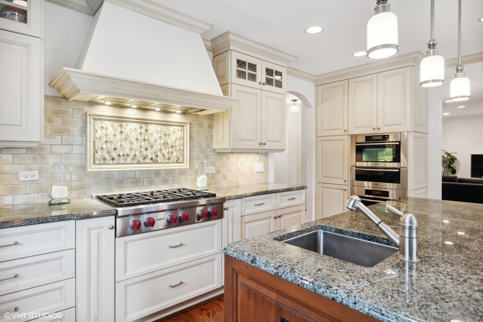 1111 Seneca Road Wilmette, IL 60091 - Photo 11 of 50 a kitchen with stainless steel appliances granite countertop a sink stove and cabinets