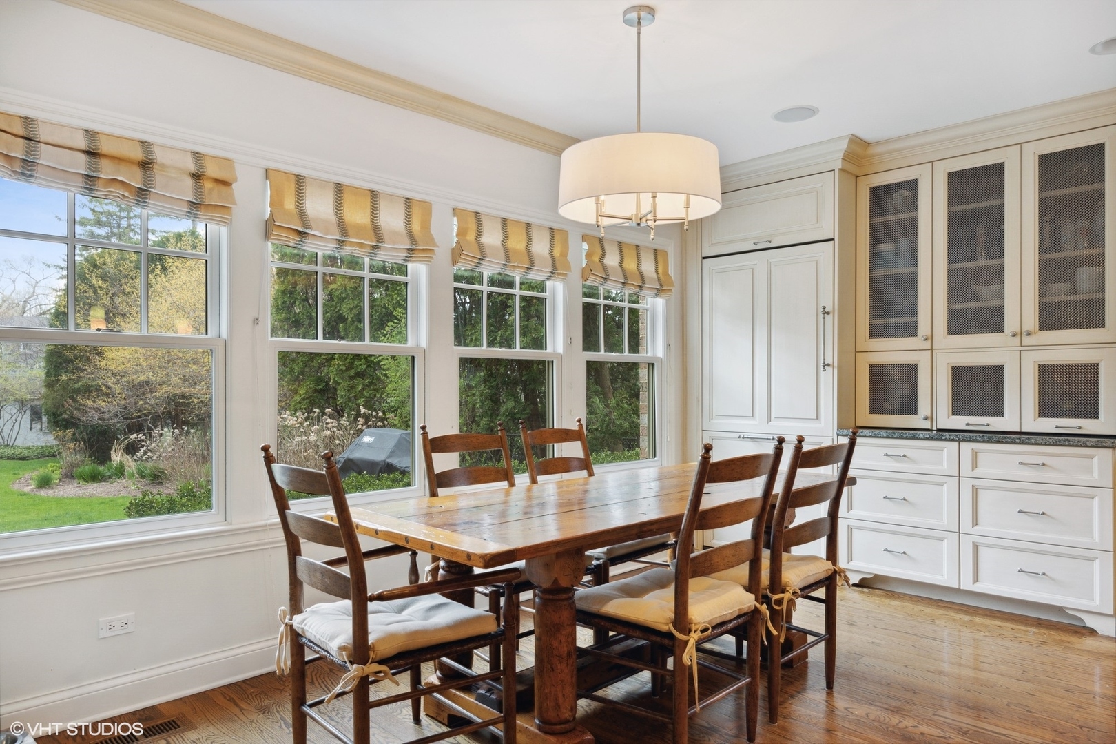 1111 Seneca Road Wilmette, IL 60091 - Photo 12 of 50 a view of a dining room with furniture window and wooden floor