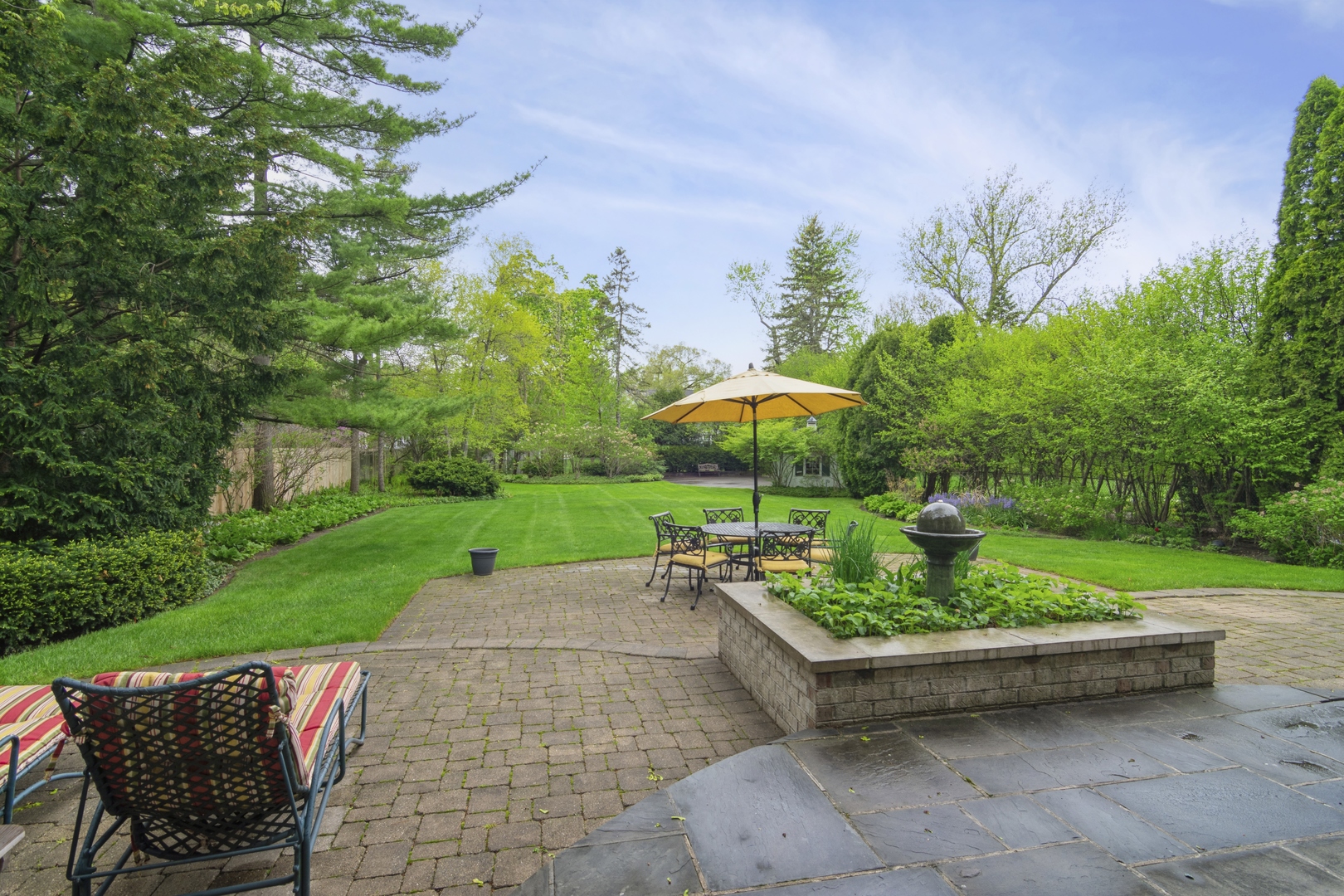 1111 Seneca Road Wilmette, IL 60091 - Photo 13 of 50 a backyard of a house with a yard and outdoor seating