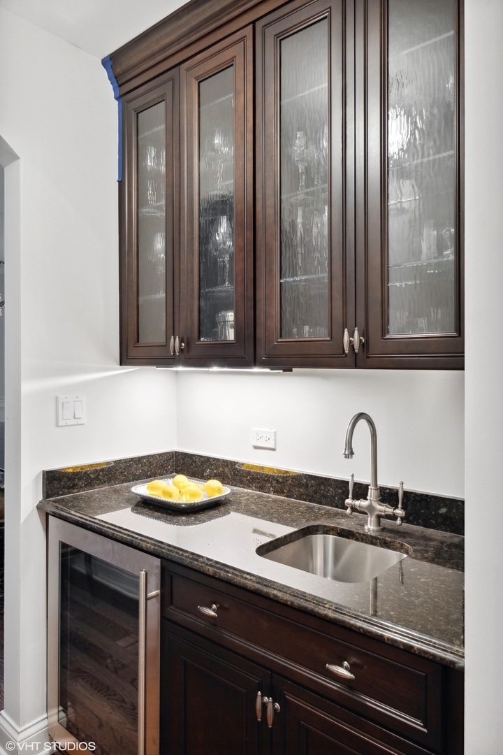 1111 Seneca Road Wilmette, IL 60091 - Photo 17 of 50 a bathroom with a sink and a mirror