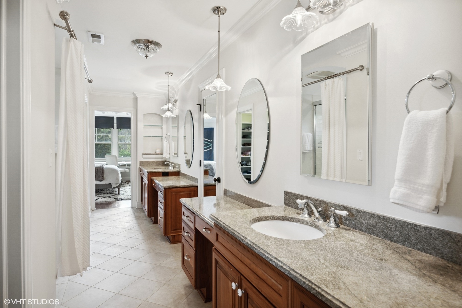 1111 Seneca Road Wilmette, IL 60091 - Photo 28 of 50 a spacious bathroom with a granite countertop sink a mirror a vanity and a shower