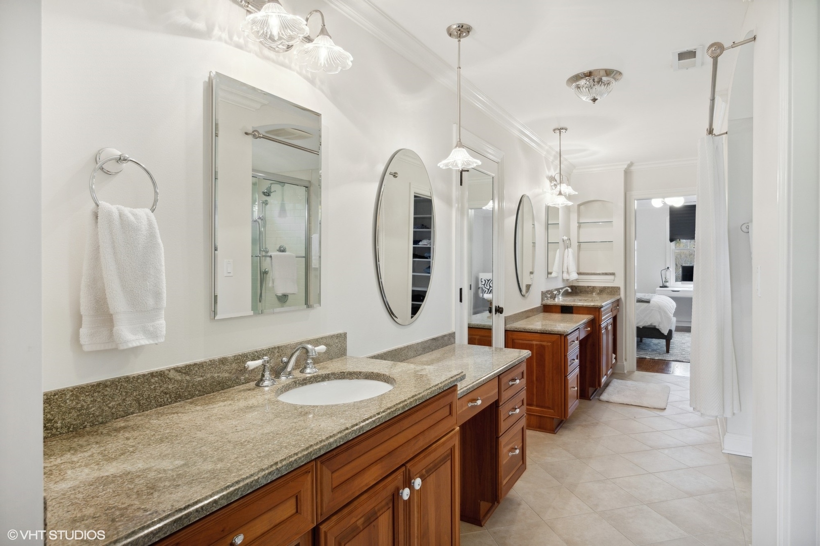 1111 Seneca Road Wilmette, IL 60091 - Photo 29 of 50 a bathroom with sinks granite countertop a sink and a mirror