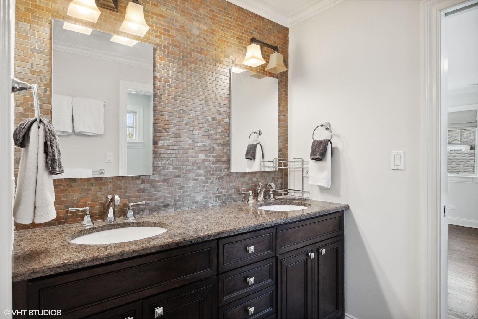 1111 Seneca Road Wilmette, IL 60091 - Photo 32 of 50 a bathroom with double sink and a mirror