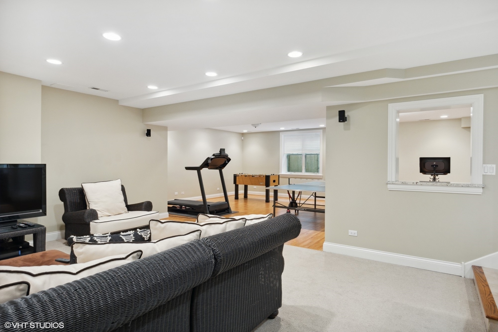 1111 Seneca Road Wilmette, IL 60091 - Photo 41 of 50 a living room with furniture a flat screen tv and a window