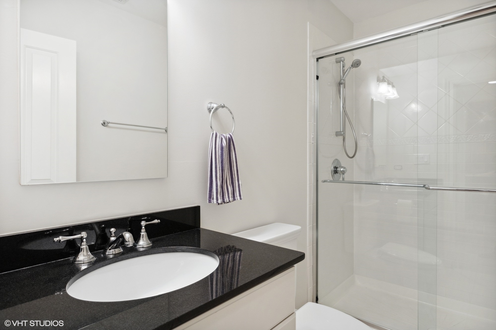 1111 Seneca Road Wilmette, IL 60091 - Photo 43 of 50 a bathroom with a sink and a mirror