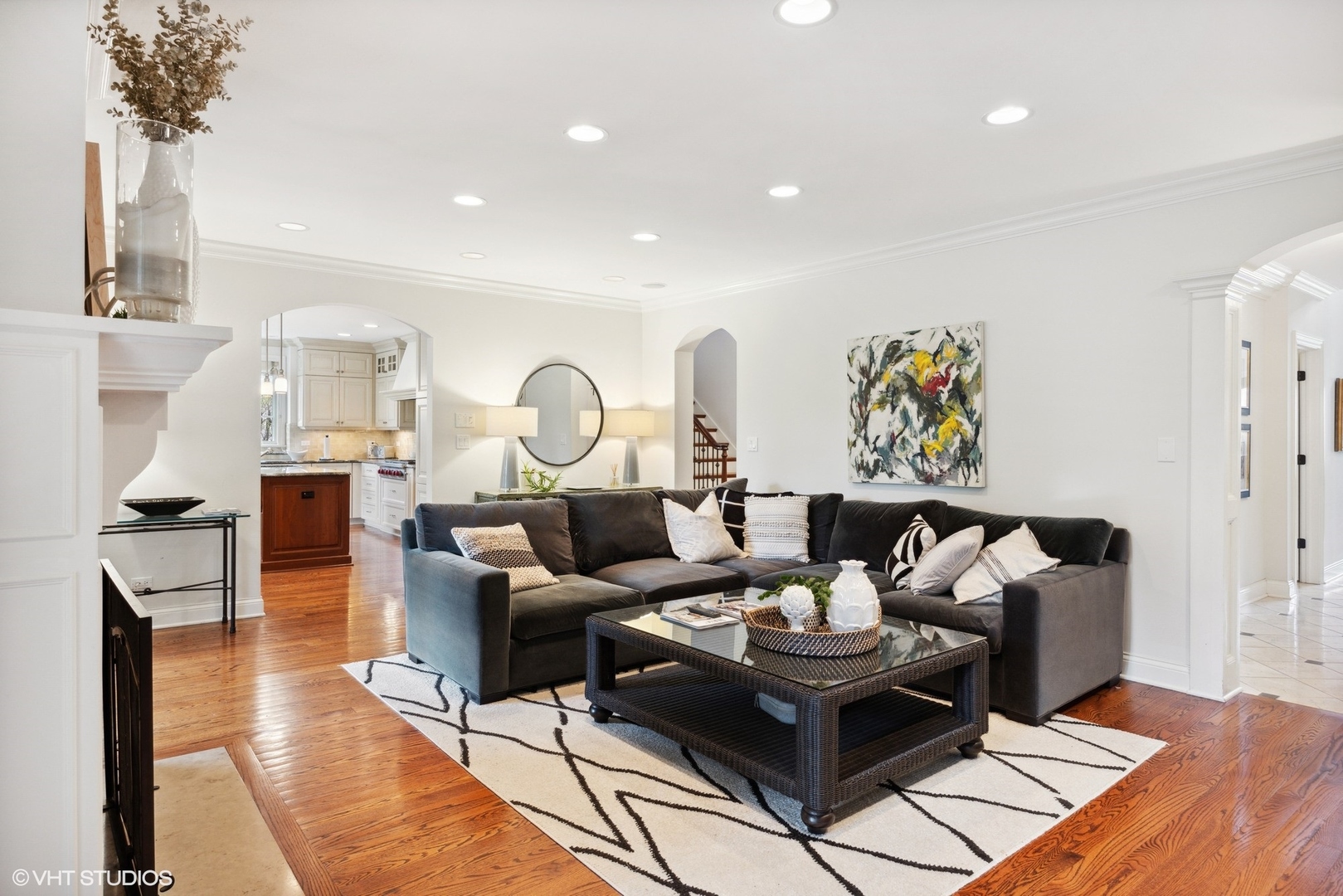 1111 Seneca Road Wilmette, IL 60091 - Photo 7 of 50 a living room with furniture and a chandelier