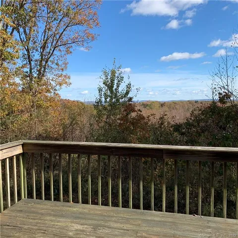 a view of balcony and wooden floor