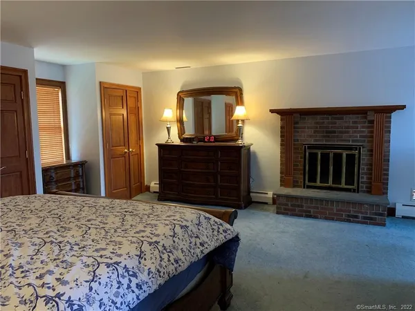 a view of an empty room with a kitchen