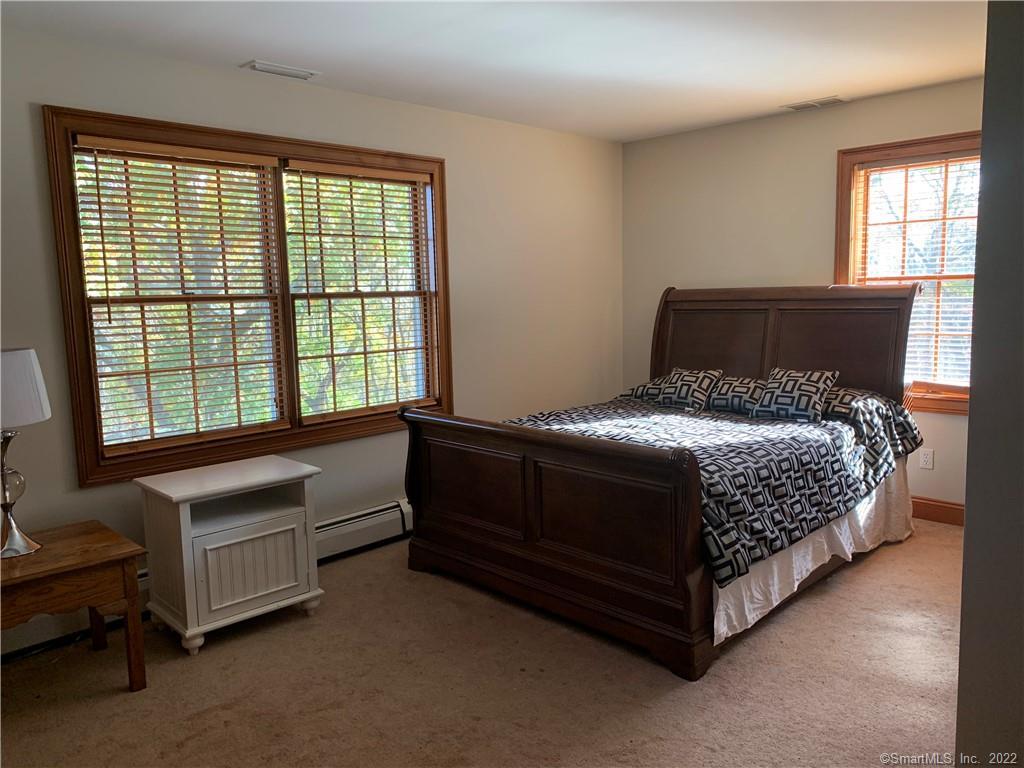 38 Merriman Lane Prospect, CT 06712 - Photo 25 of 35 a bed sitting in a bedroom next to a window