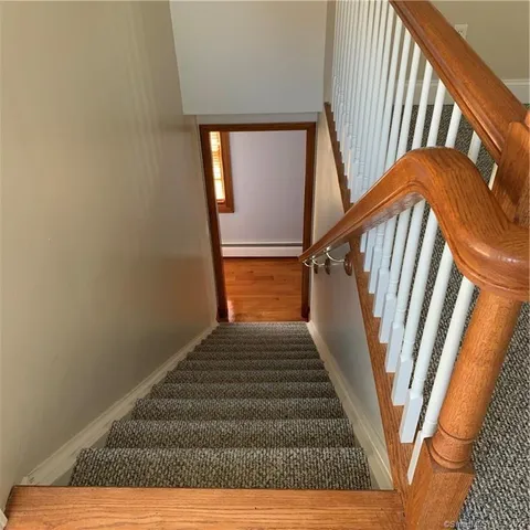 a reading room with furniture and a window