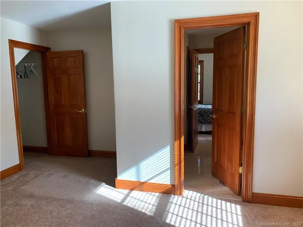 a reading room with furniture and a window