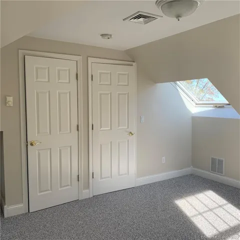 a room with furniture and gym equipment