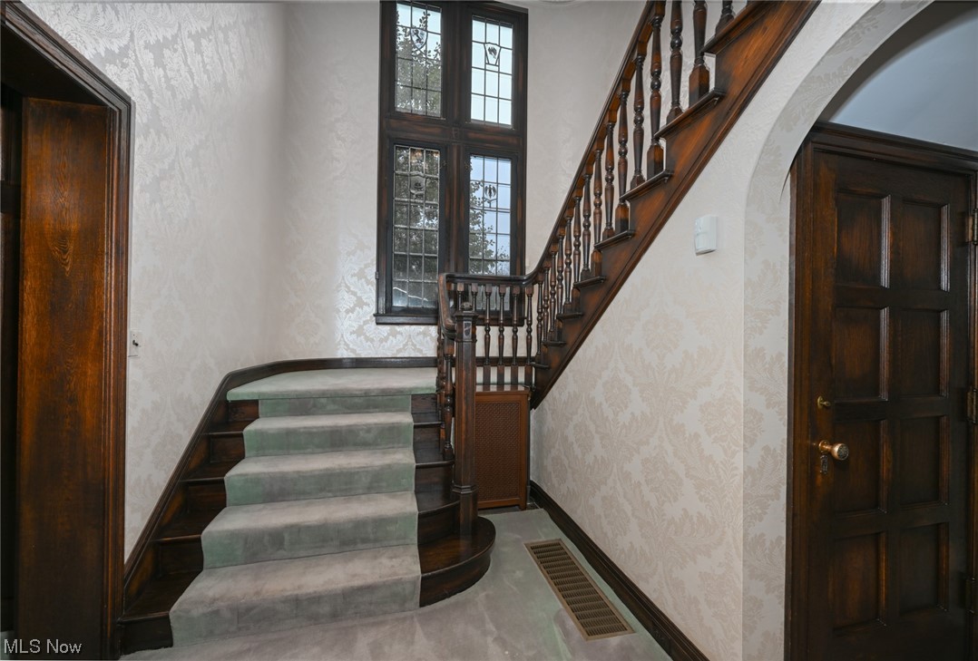 871 Merriman Road Akron, OH 44303 - Photo 21 of 35 Grand staircase with a beautiful view of the front of home