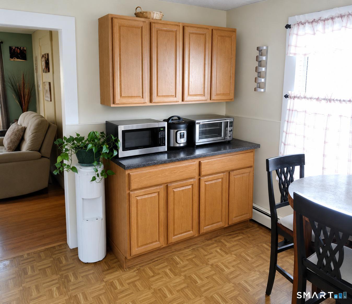 61 Bartlett Street Meriden, CT 06451 - Photo 18 of 30 a kitchen with a refrigerator and cabinets