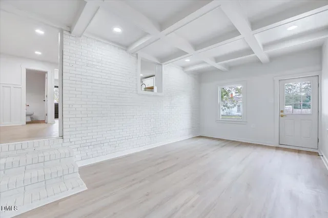 a kitchen with white cabinets stainless steel appliances and sink