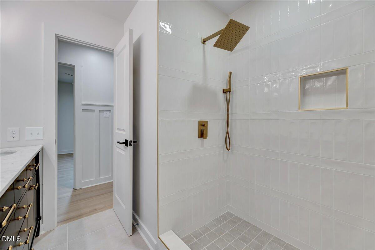 601 West Walnut Street Selma, NC 27576 - Photo 20 of 30 a bathroom with a shower and a sink