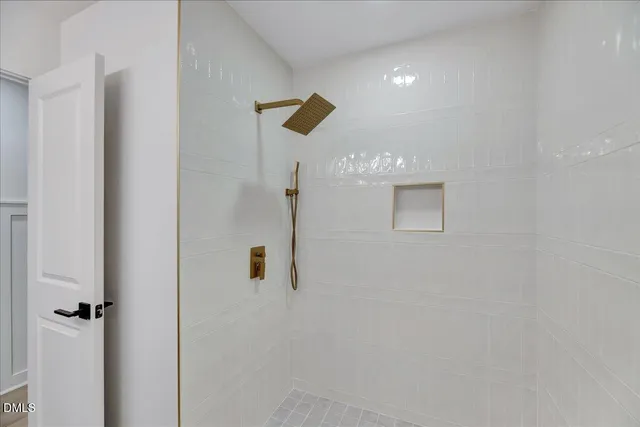 a bathroom with a shower and a sink
