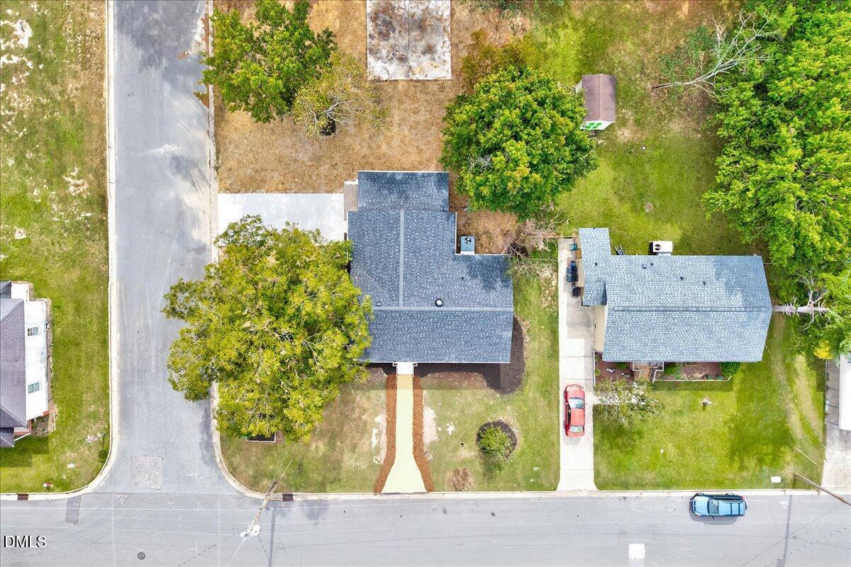 601 West Walnut Street Selma, NC 27576 - Photo 28 of 30 an aerial view of residential houses with outdoor space