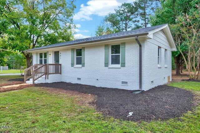 a picture of a bench in front of a house