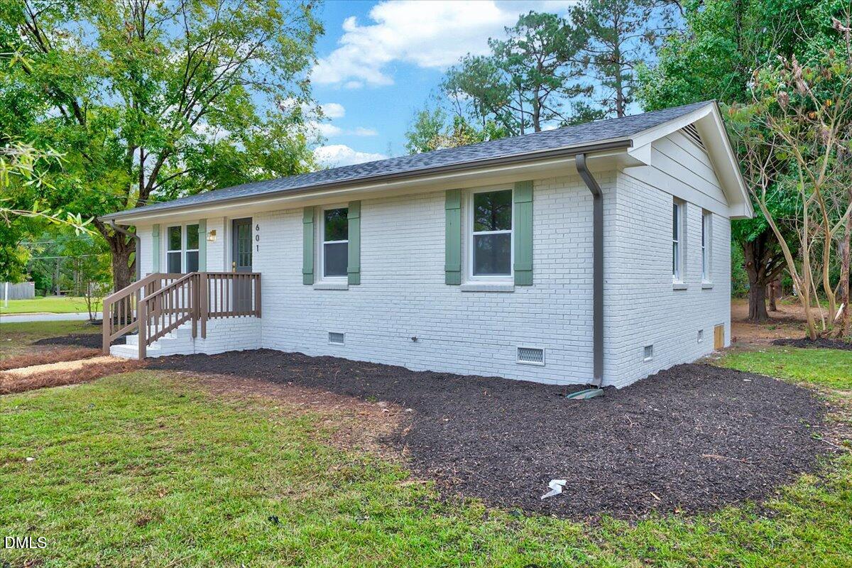 601 West Walnut Street Selma, NC 27576 - Photo 3 of 30 a view of a house with a yard