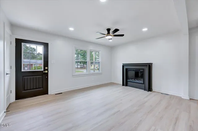 a view of a kitchen with a sink hardwood floor and a kitchen