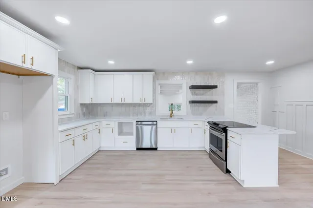 a view of kitchen with wooden floor and window