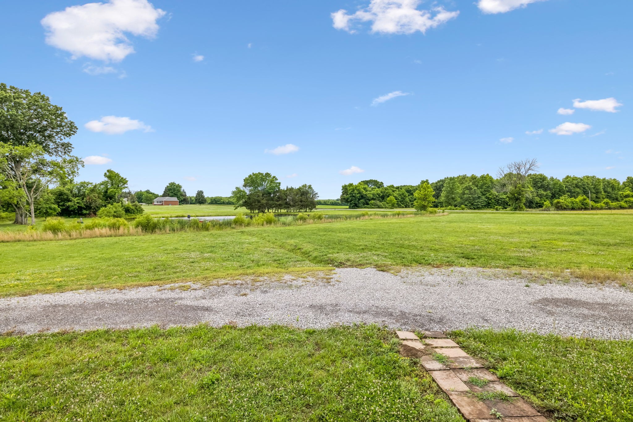 280 Kingdom Road Unionville, TN 37180 - Photo 4 of 65 a view of a golf course with a big yard