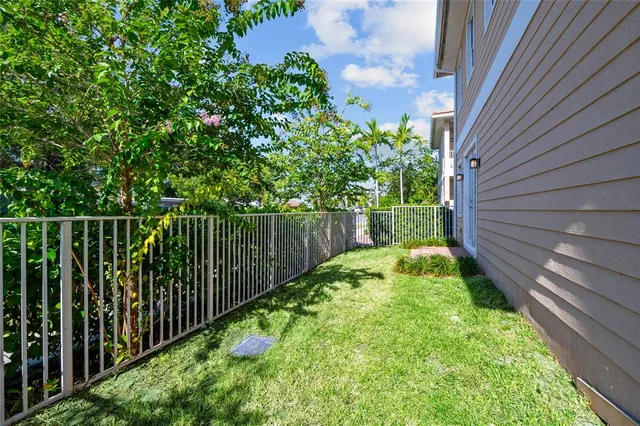 a view of a backyard with potted plants