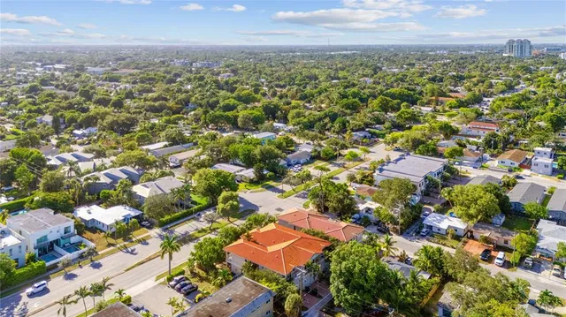an aerial view of residential building with green space