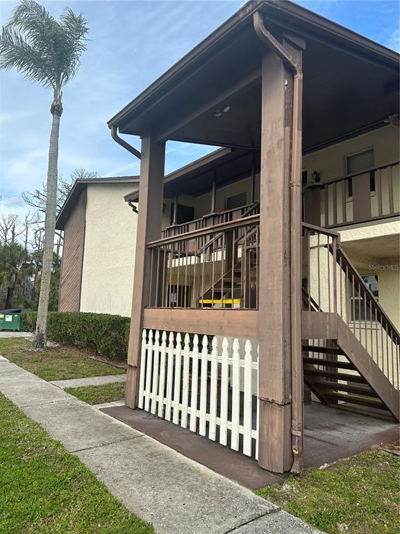 8440 Old Post Road, Unit 202 Port Richey, FL 34668 - Photo 1 of 17 a view of a house with a yard
