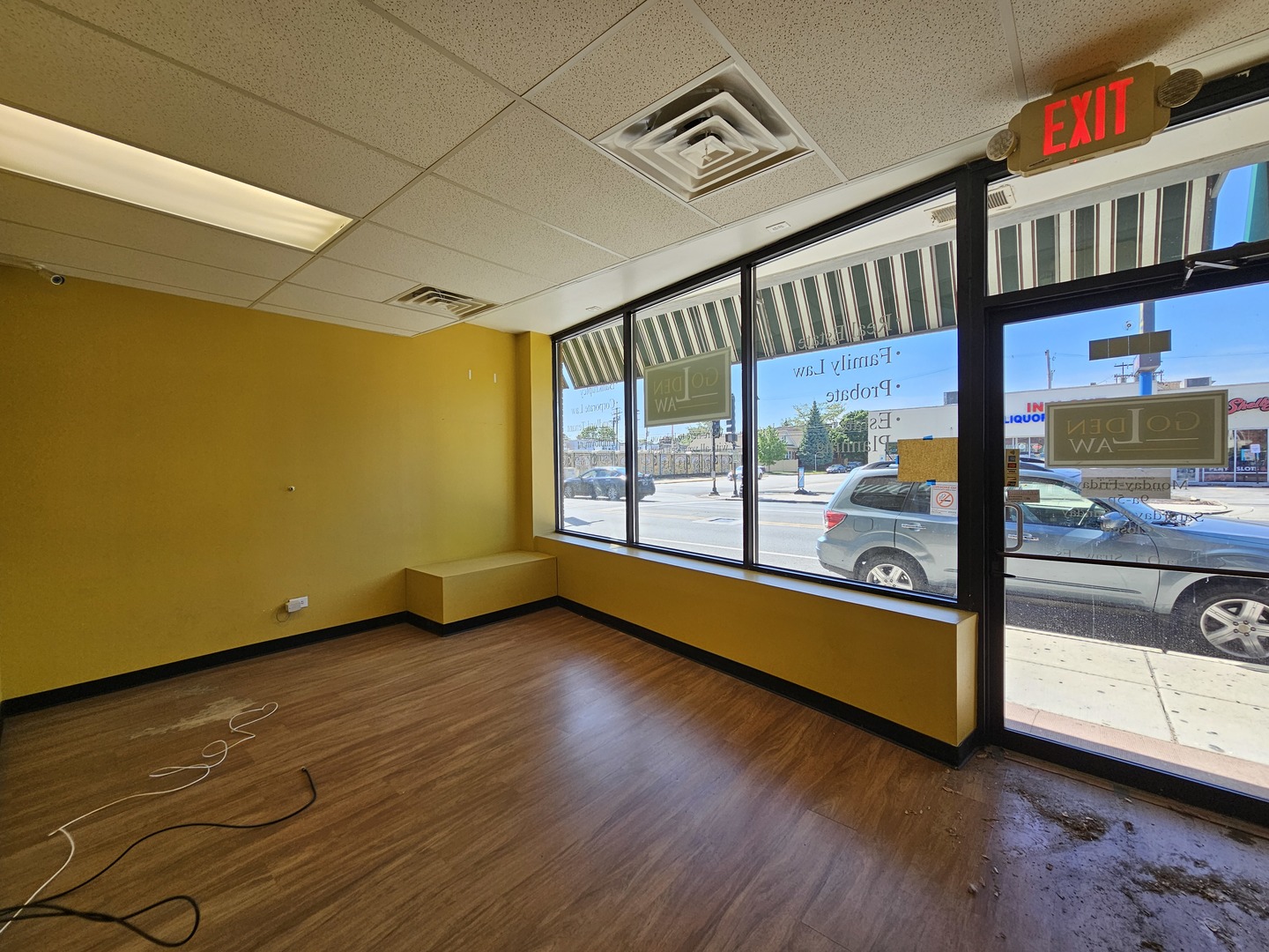 6600-04 West Roosevelt Road West Oak Park, IL 60304 - Photo 3 of 23 a view of an empty room with wooden floor and a window