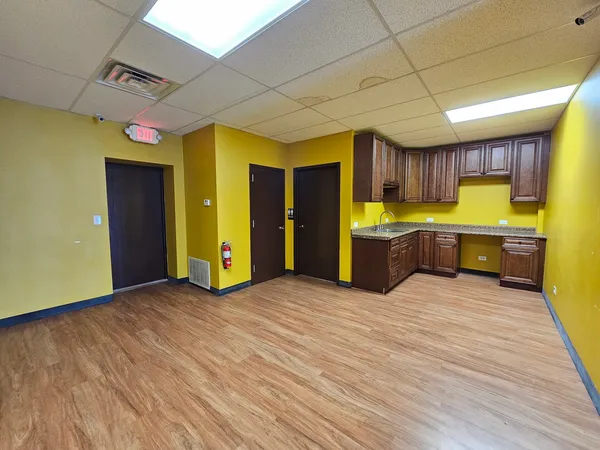 a view of a kitchen with a sink and a dishwasher