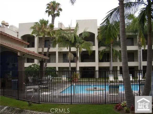 a view of a house with a garden and pathway