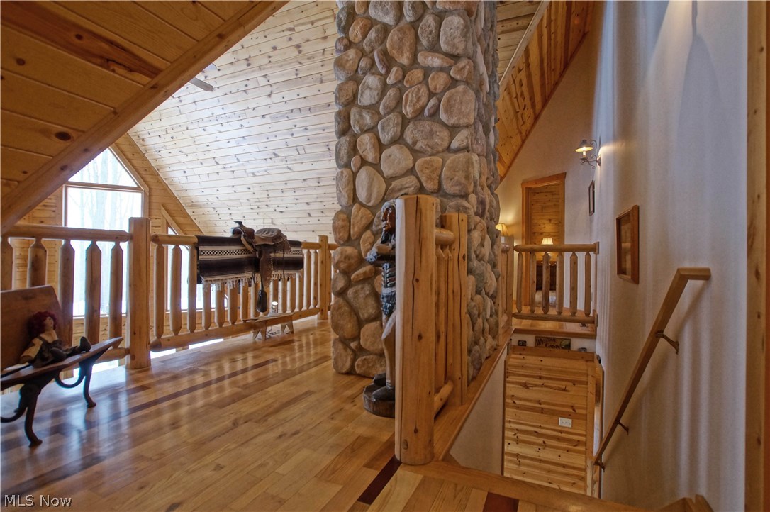 6840 Williams Road Painesville, OH 44077 - Photo 24 of 34 The main staircase leads to one of the lofts. A bedroom is at the end of the hall. A full bath is also on this level.