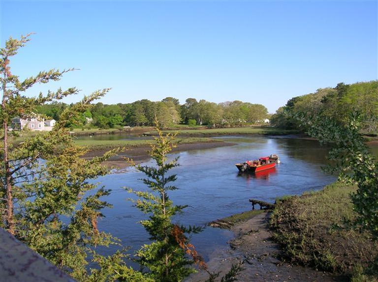 161 Route 28, Unit 7 West Harwich, MA 02671 - Photo 15 of 16 a view of a lake with a mountain
