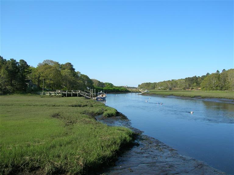 161 Route 28, Unit 7 West Harwich, MA 02671 - Photo 2 of 16 a view of lake with green space