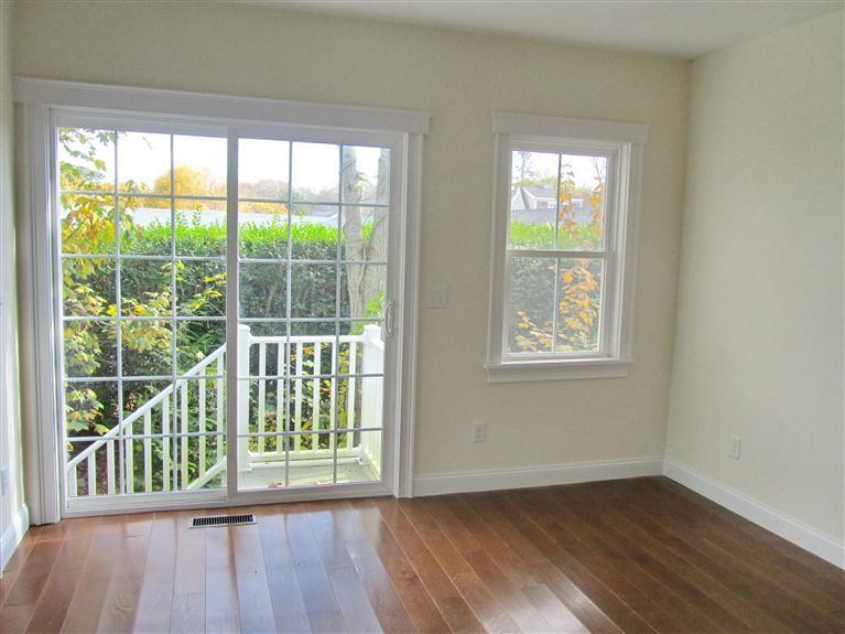 161 Route 28, Unit 7 West Harwich, MA 02671 - Photo 7 of 16 a view of a room with wooden floor and windows