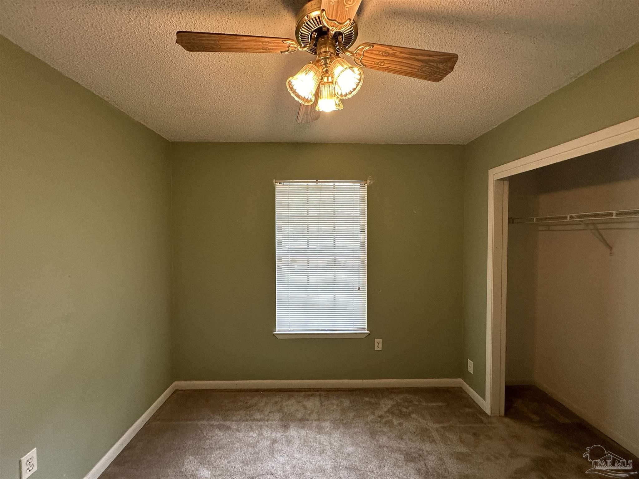 511 Maple Avenue Niceville, FL 32578 - Photo 12 of 17 an empty room with a window