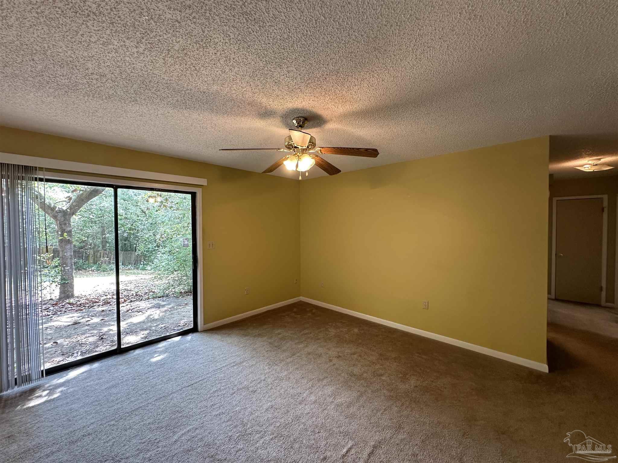 511 Maple Avenue Niceville, FL 32578 - Photo 7 of 17 a view of a livingroom with a ceiling fan and window