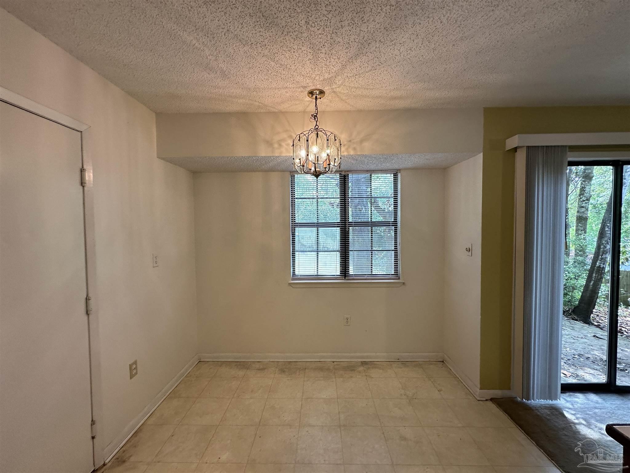 511 Maple Avenue Niceville, FL 32578 - Photo 8 of 17 a view of an empty room with a window