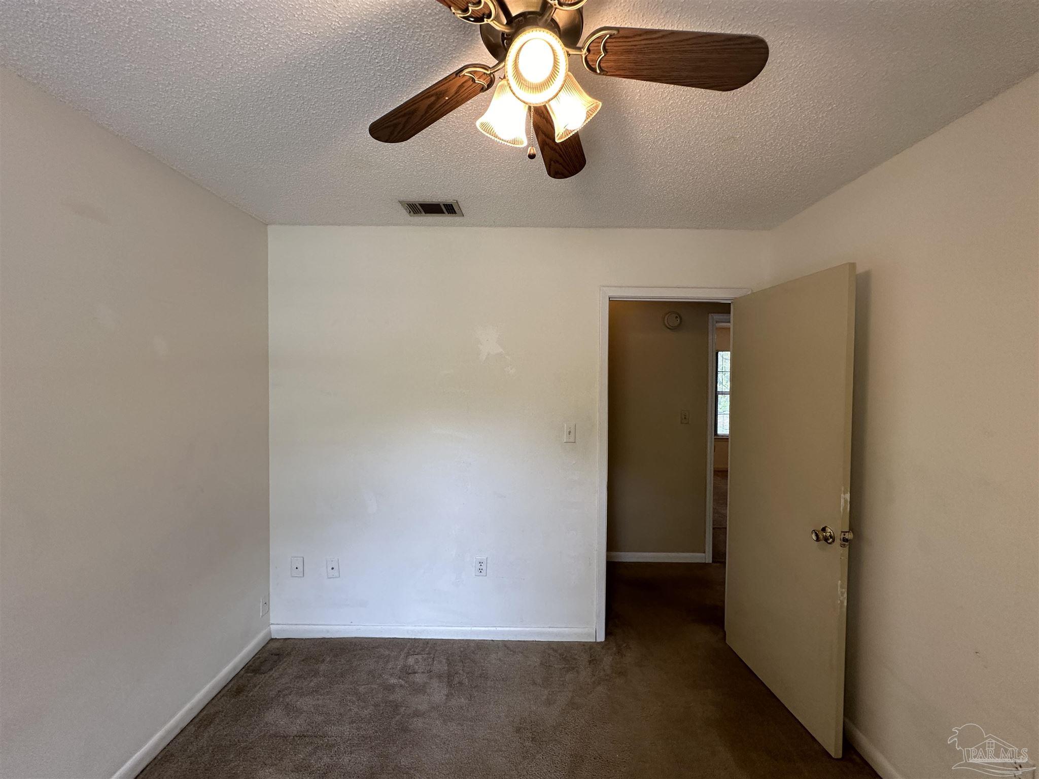 511 Maple Avenue Niceville, FL 32578 - Photo 10 of 17 wooden floor in an empty room
