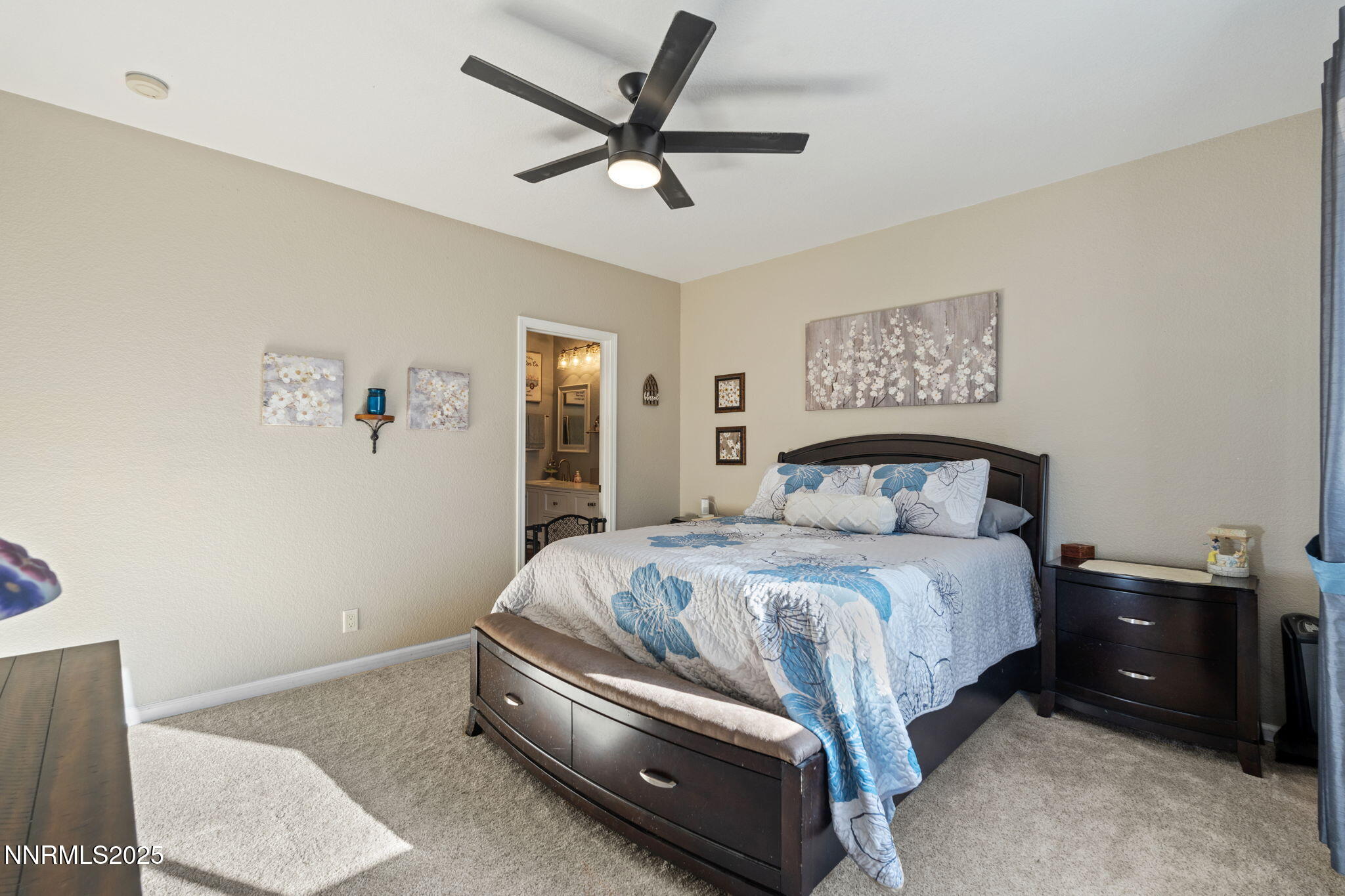 2155 Eagle Greens Drive Reno, NV 89521 - Photo 18 of 31 a bedroom with a bed and a painting on the wall