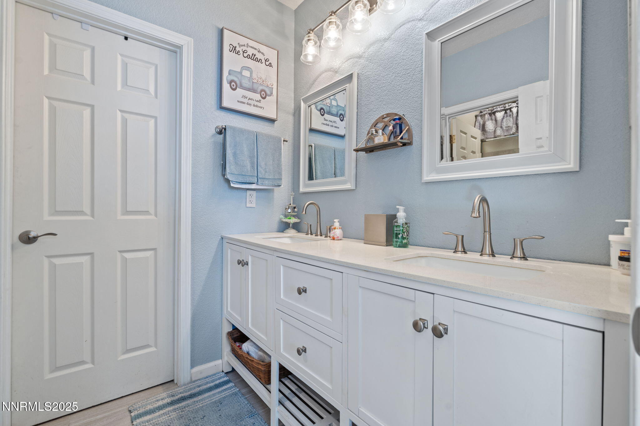 2155 Eagle Greens Drive Reno, NV 89521 - Photo 19 of 31 a spacious bathroom with a double vanity sink and a mirror