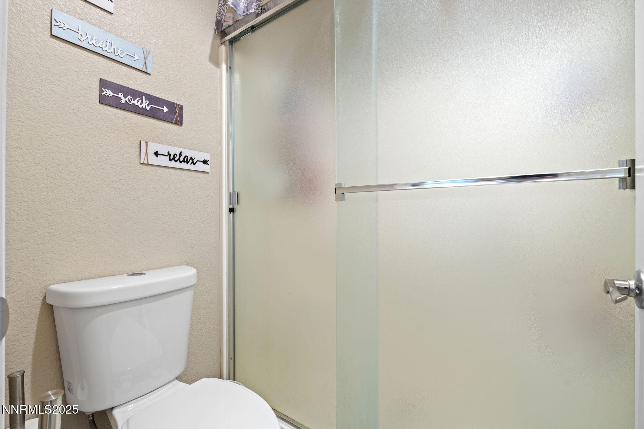 2155 Eagle Greens Drive Reno, NV 89521 - Photo 20 of 31 a white toilet sitting next to a shower