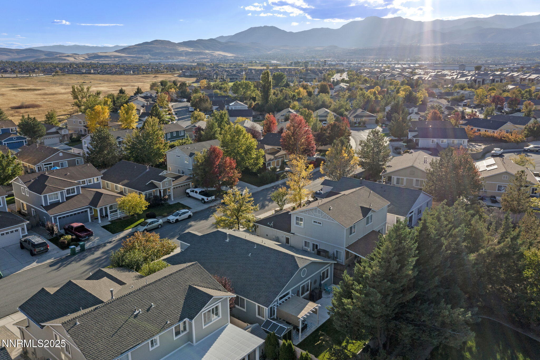 2155 Eagle Greens Drive Reno, NV 89521 - Photo 31 of 31 an aerial view of a city with lots of residential buildings and mountain view in back