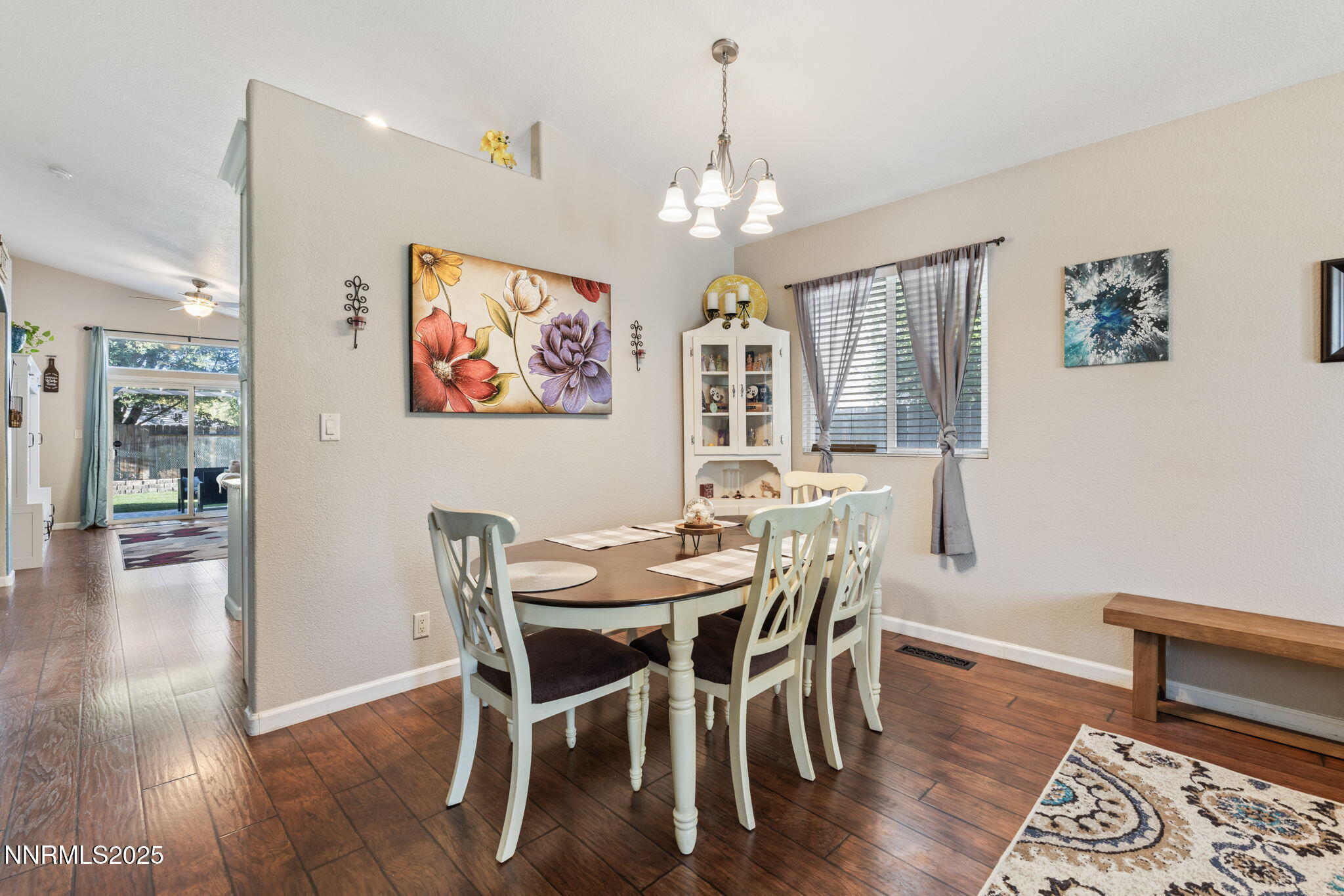 2155 Eagle Greens Drive Reno, NV 89521 - Photo 5 of 31 a view of a dining room with furniture wooden floor and a chandelier