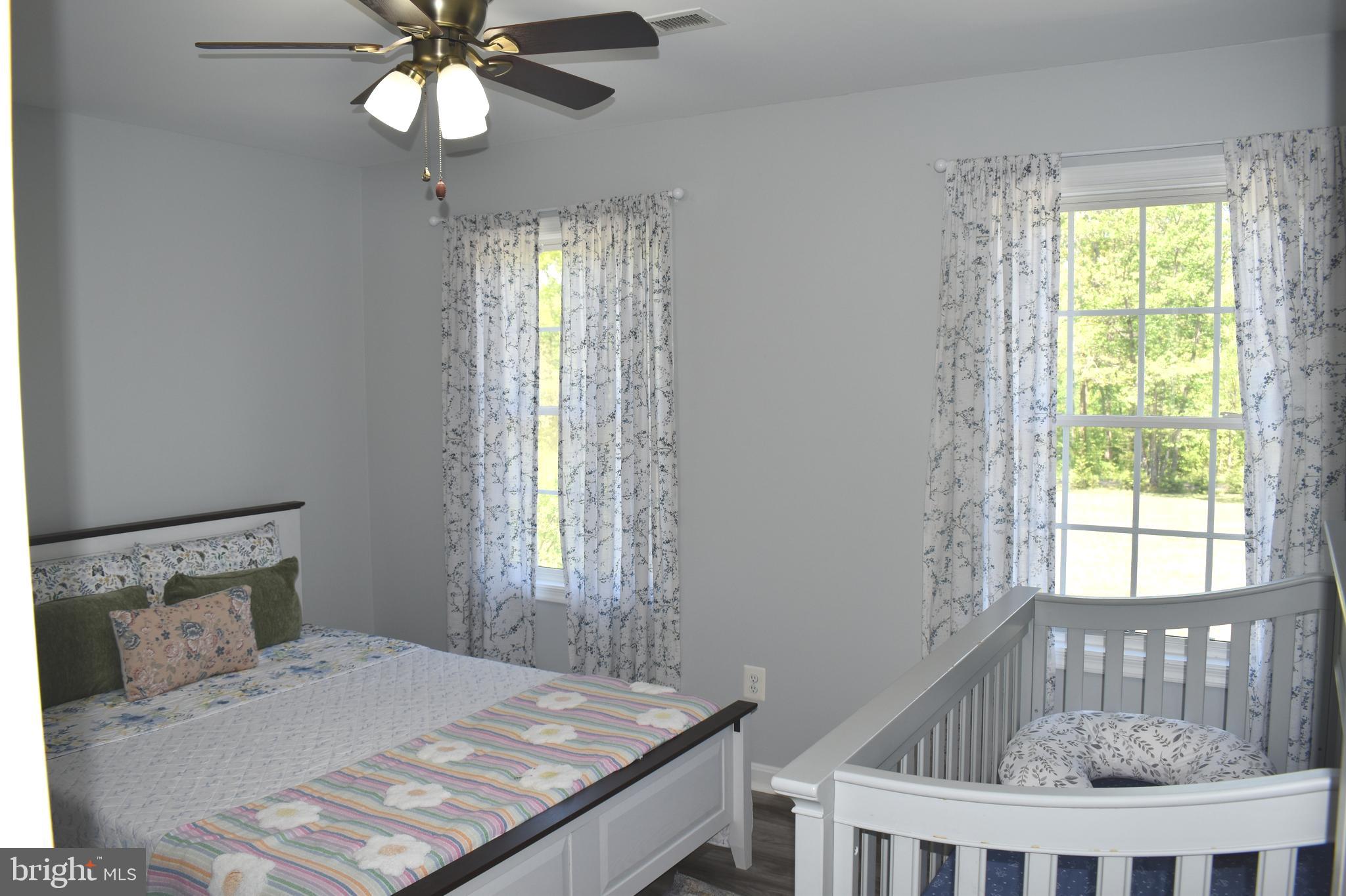 10958 Mountain Run Lake Road Culpeper, VA 22701 - Photo 19 of 31 a bedroom with a bed and a window